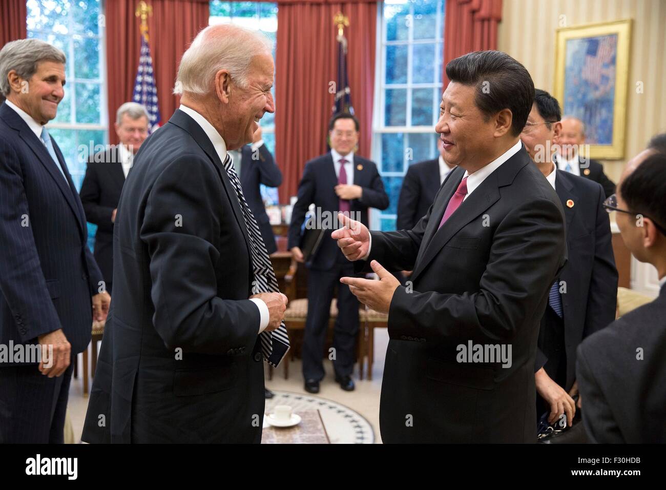 Washington DC, US. 25th Sep, 2015. Chinese President Xi Jinping jokes with U.S. Vice President Joe Biden following a bilateral meeting in the Oval Office of the White House September 25, 2015 in Washington, DC. Stock Photo
