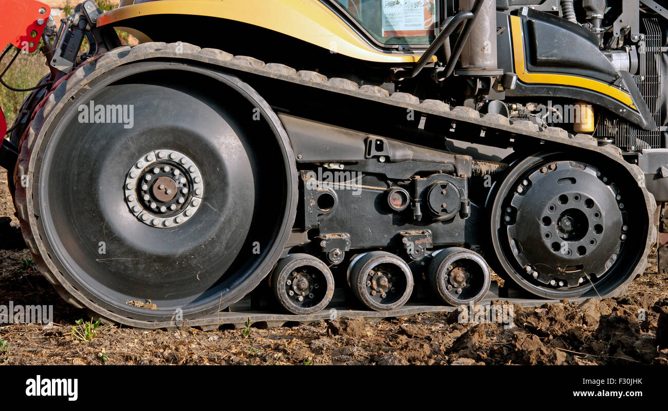 tractor outside with rubber crampons Stock Photo