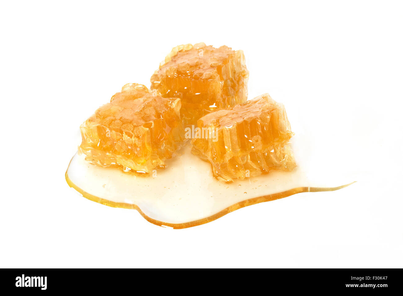 Three cubes/ pieces in honey dripping sirup made of fresh