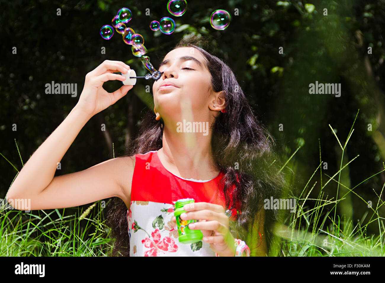 1 indian Child girl park Playing Bubble Wand Stock Photo - Alamy