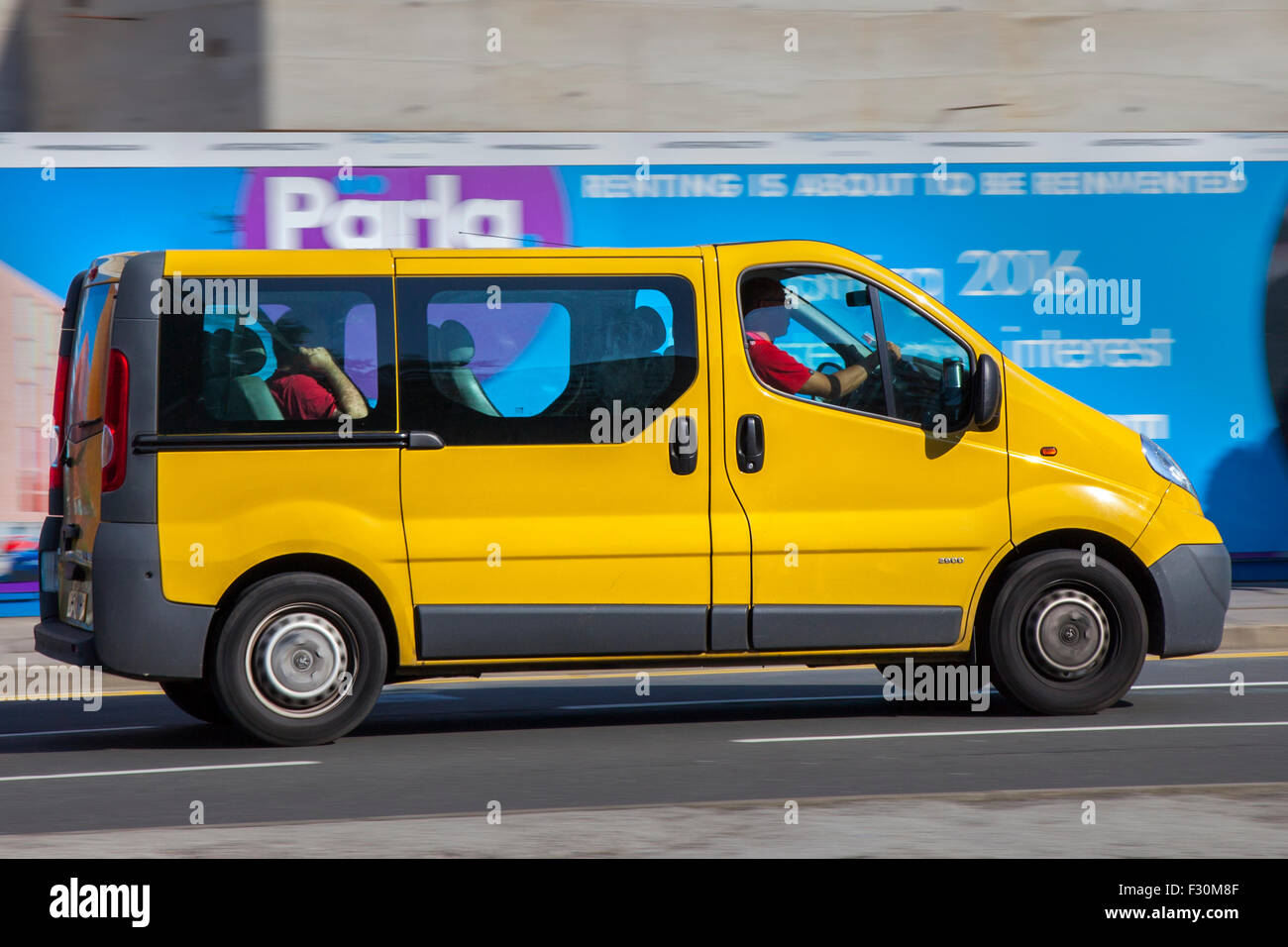 Yellow Renault trafic cars side view road blur; Passenger Van on the roads  of Liverpool, Merseyside, UK. Vehicular Traffic on The Strand Stock Photo -  Alamy