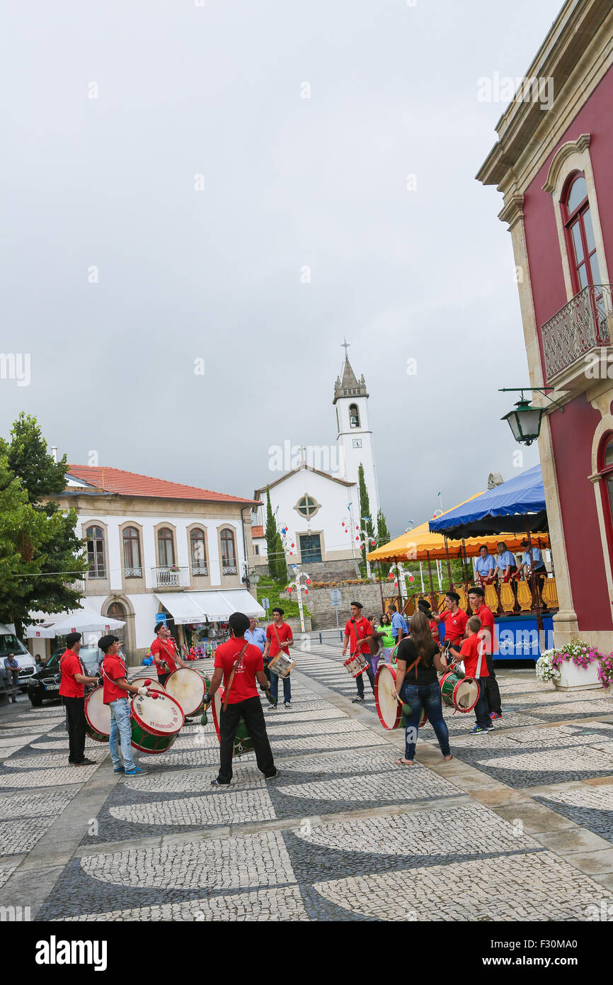 PAREDES DE COURA, PORTUGAL - AUGUST 8, 2014: Folkloristic drum band in the center of Paredes de Coura in Norte region, Portugal Stock Photo