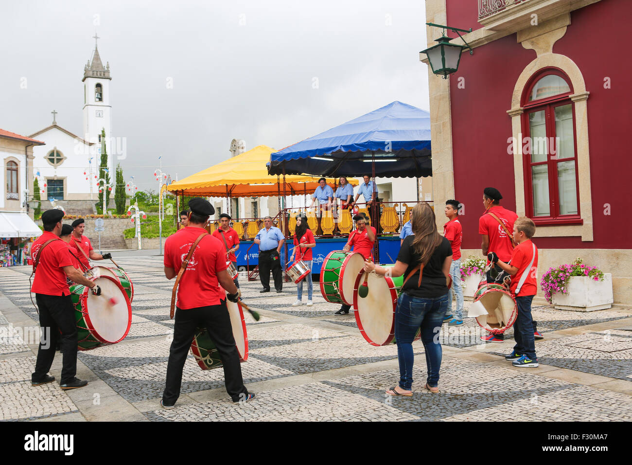 PAREDES DE COURA, PORTUGAL - AUGUST 8, 2014: Folkloristic drum band in the center of Paredes de Coura in Norte region, Portugal Stock Photo