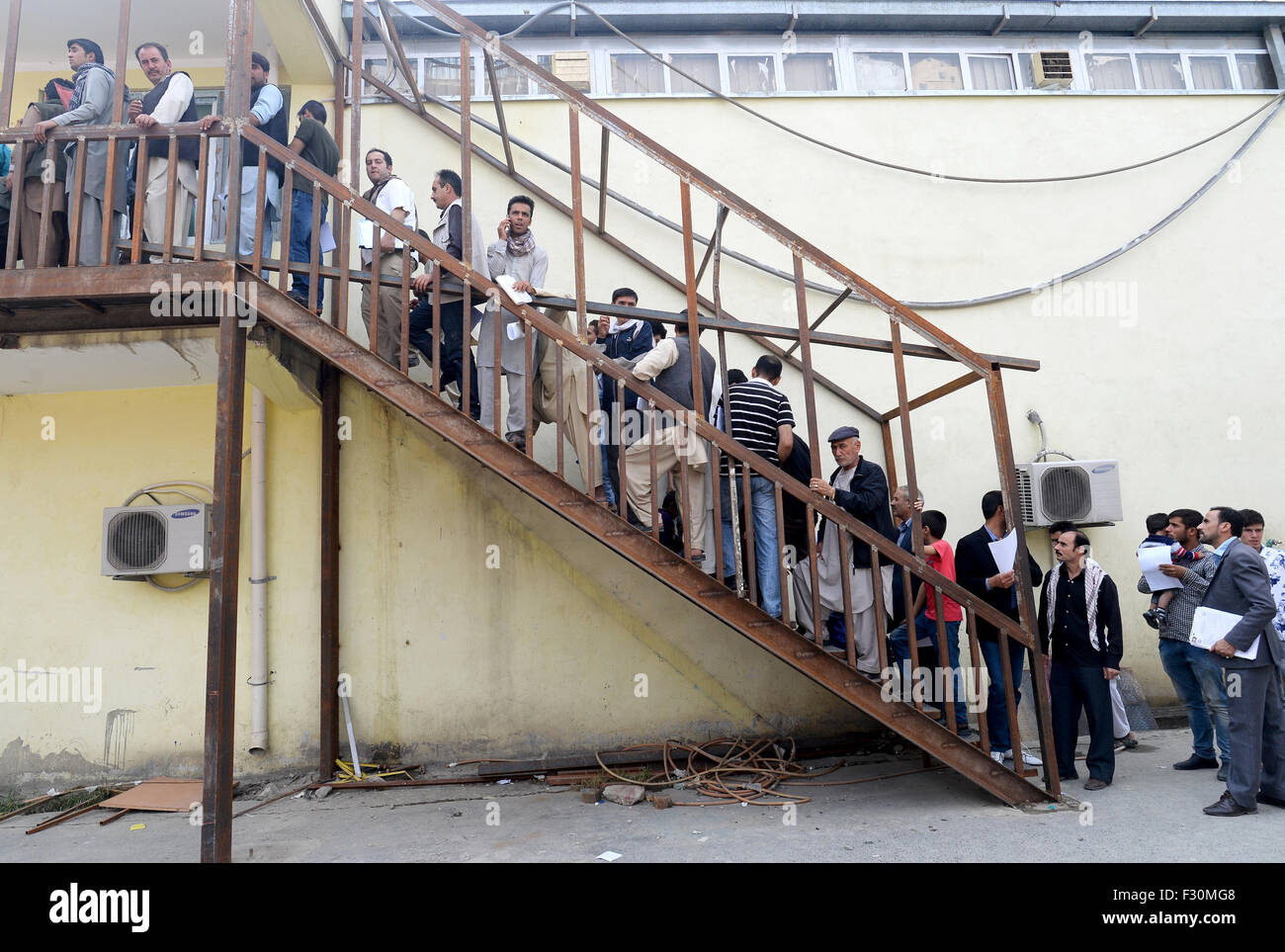 Kabul, Afghanistan. 22nd Sep, 2015. Afghan nationals wait for their biometric examination at a passport office in Kabul, Afghanistan, 22 September 2015. After the Taliban regime was overthrown, many refugees returned to Afghanistan. The number of people from Afghanistan seeking refuge in the European Union (EU) is only second to Syria as a new mass exodus is setting in. Photo: Subel Bandari/dpa/Alamy Live News Stock Photo