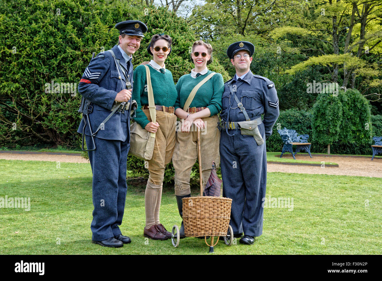 Living historians as uniformed RAF Police from the 1940s era together with members of the Womens Land Army in authentic dress Stock Photo