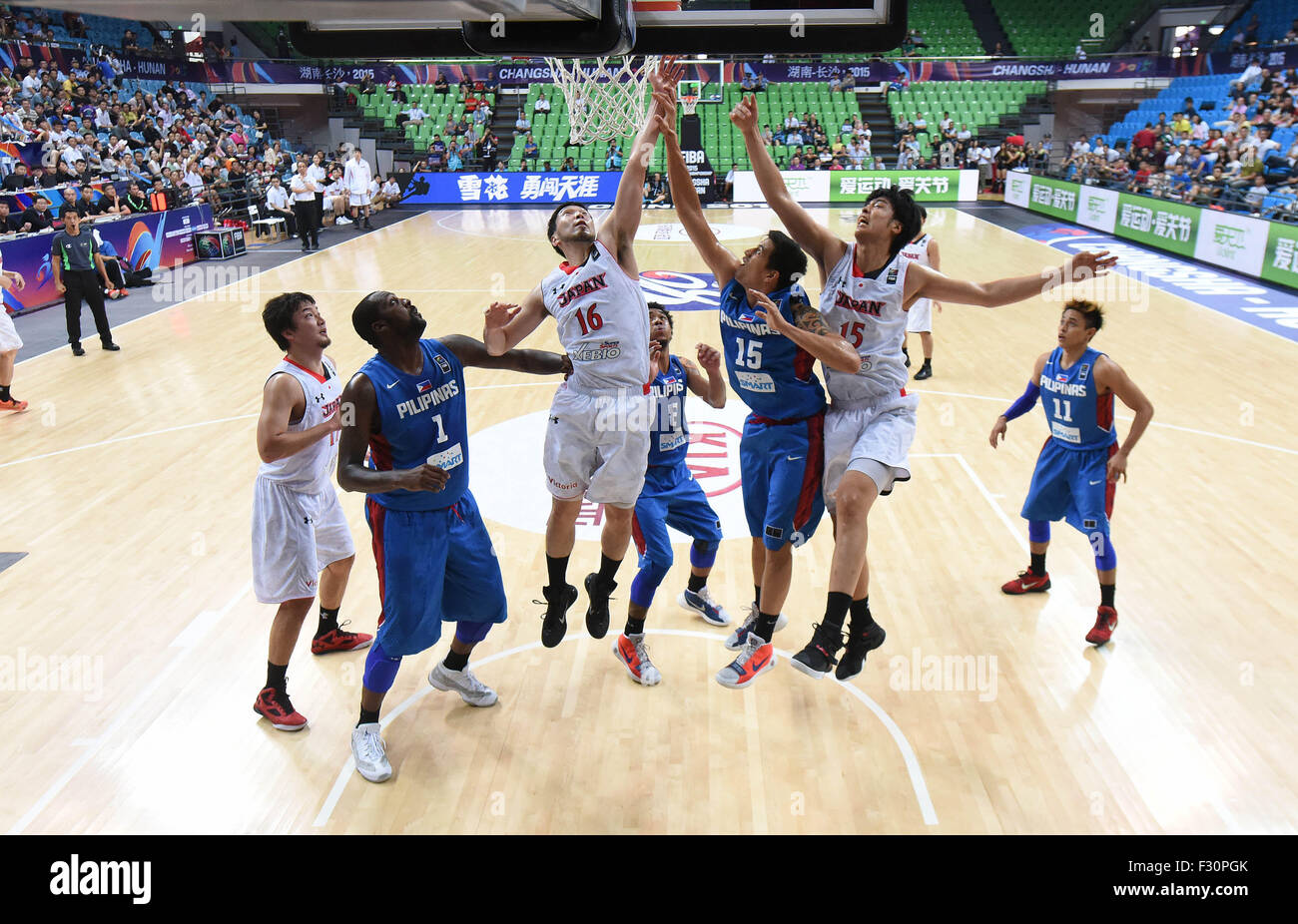 (150927) -- CHANGSHA, Sept. 27, 2015, (Xinhua) -- Keijuro Matsui (3rd L) of Japan competes during FIBA Asia Championship second round Group E match against the Philippines in Changsha, capital of central China's Hunan Province, Sept. 27, 2015. The Philippines won 73-66. (Xinhua/Li Ga) Stock Photo