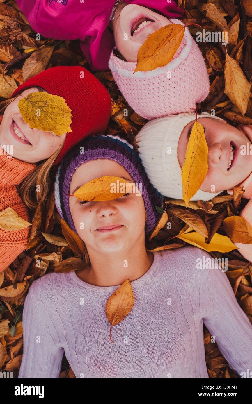 Girls playing with leaves Stock Photo - Alamy