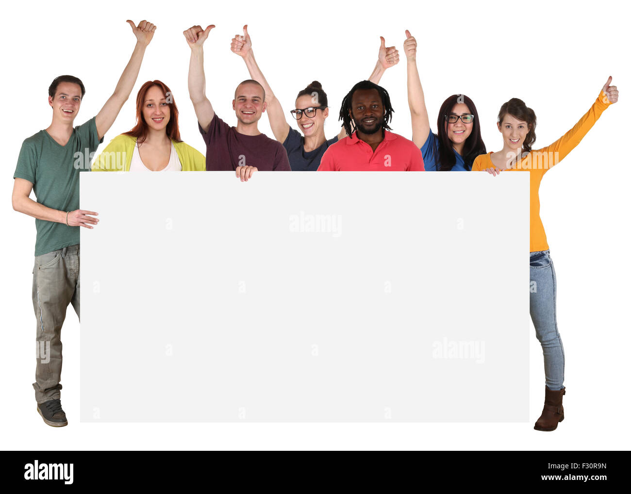 Group of happy young multi ethnic people holding empty banner with ...
