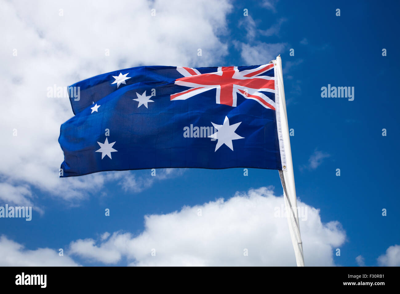 Australia flag against blue sky Stock Photo