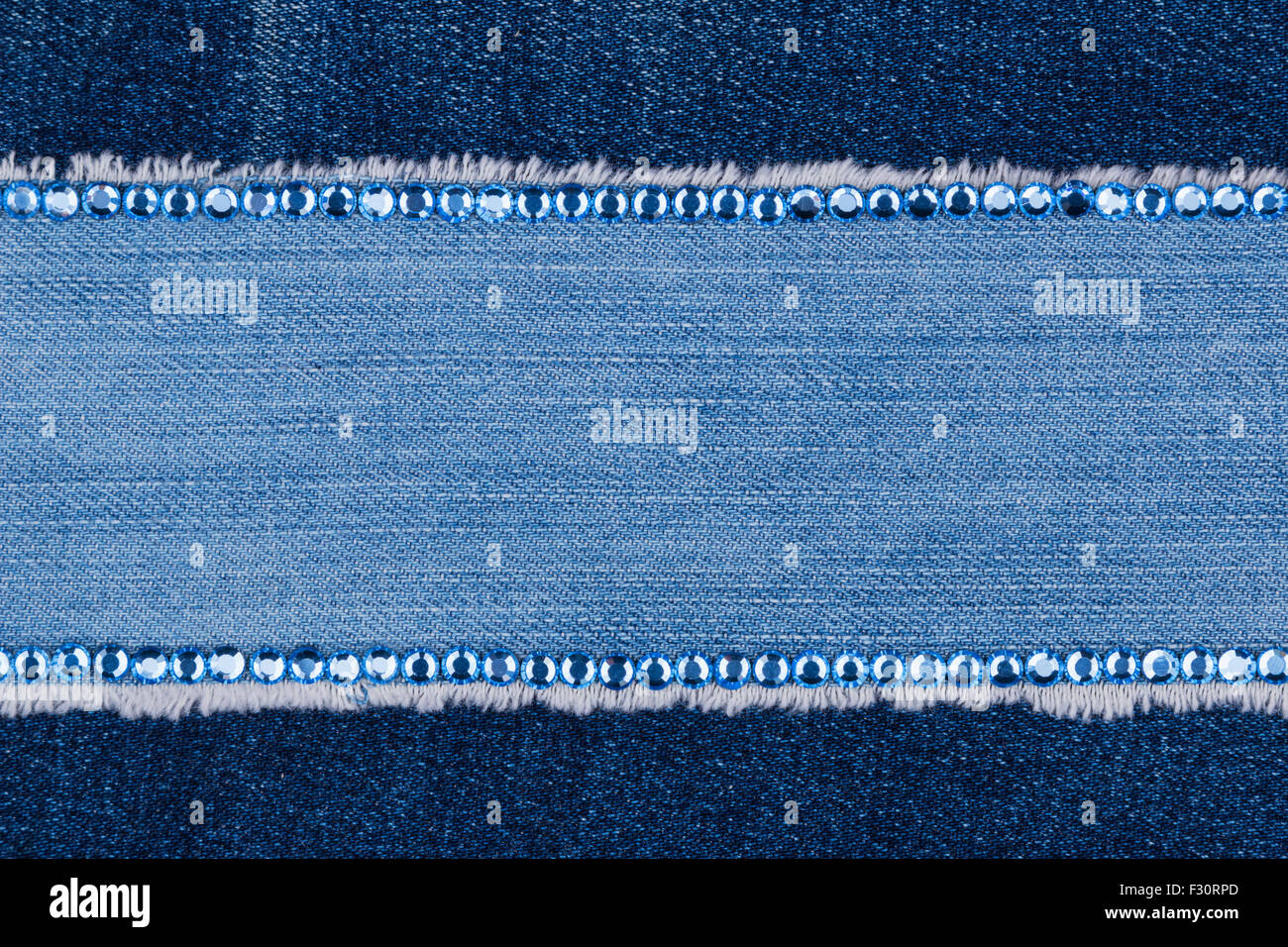 Fashionable background, jeans and blue rhinestones Stock Photo - Alamy