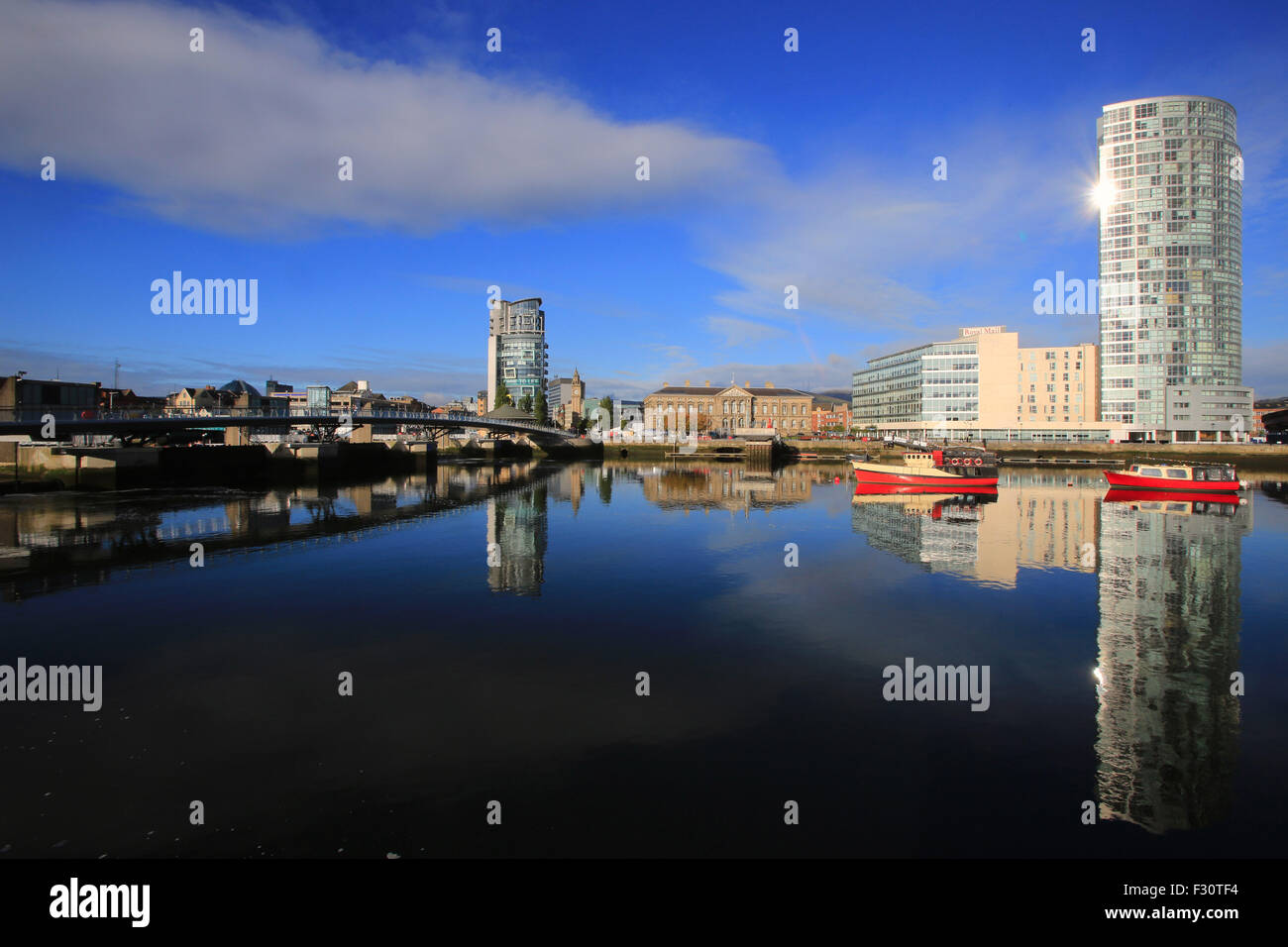 Belfast (/ˈbɛl.fɑːst/ or /ˈbɛl.fæst/; from Irish: Béal Feirste, meaning 'mouth of the sandbanks')[11] is the capital and largest Stock Photo