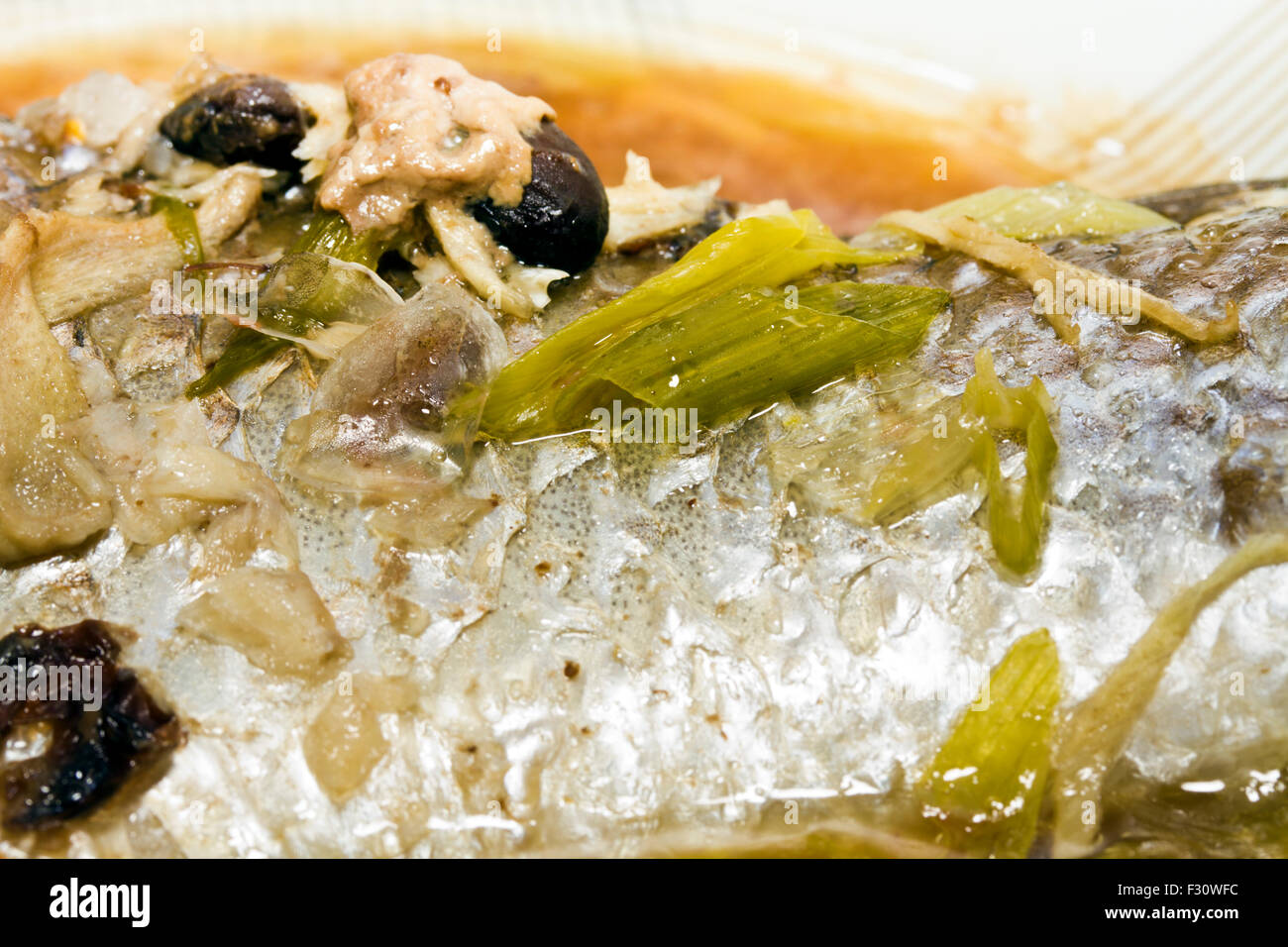 Whole fish in sauce hires stock photography and images Alamy