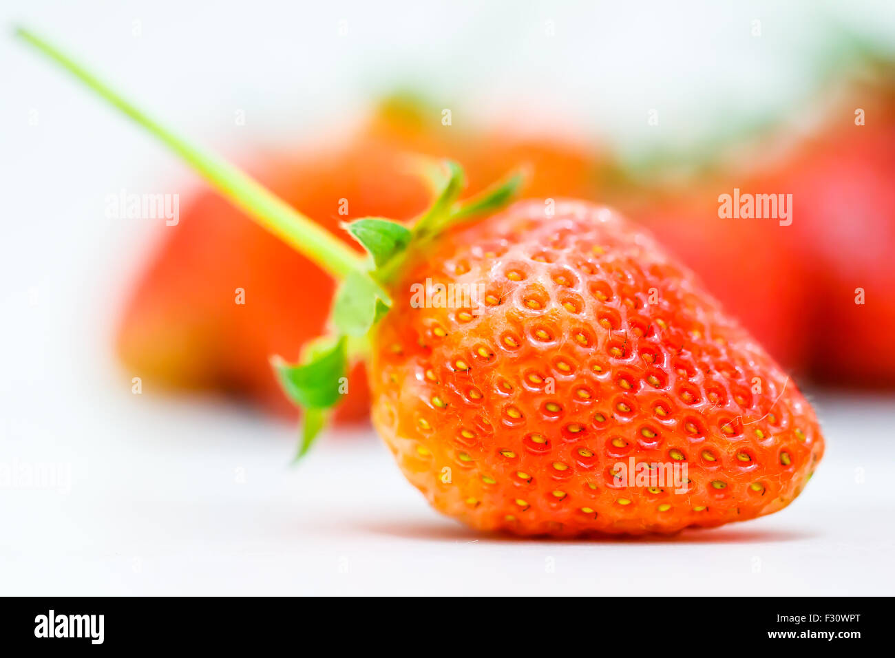 Strawberry berries on a white background Stock Photo - Alamy