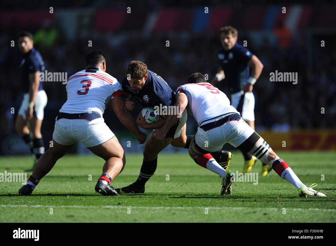 27 September 2015: Ross Ford of Scotland is tackled by Titi Lamositele and Greg Peterson of USA during Match 18 of the Rugby World Cup 2015 between Scotland and USA, Elland Road, Leeds, England (Photo by Rob Munro/CSM) Stock Photo