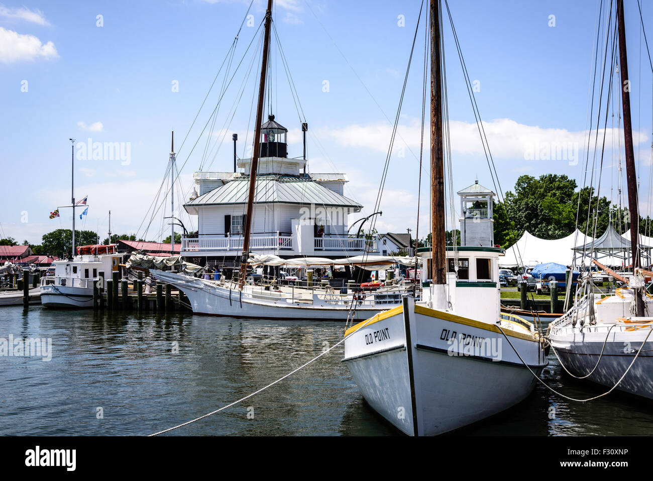 1909 Virginia Crab Dredger 'Old Point' & Hooper Strait Lighthouse, Chesapeake Bay Maritime Museum, St. Michaels, Maryland Stock Photo