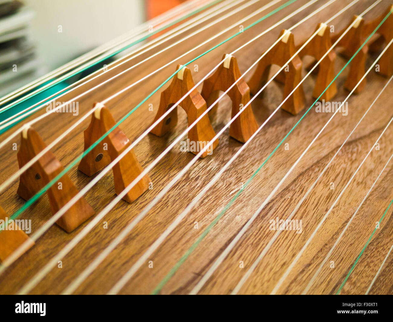 Strings and bridges of Chinese ancient instrument Gu Zheng Stock Photo