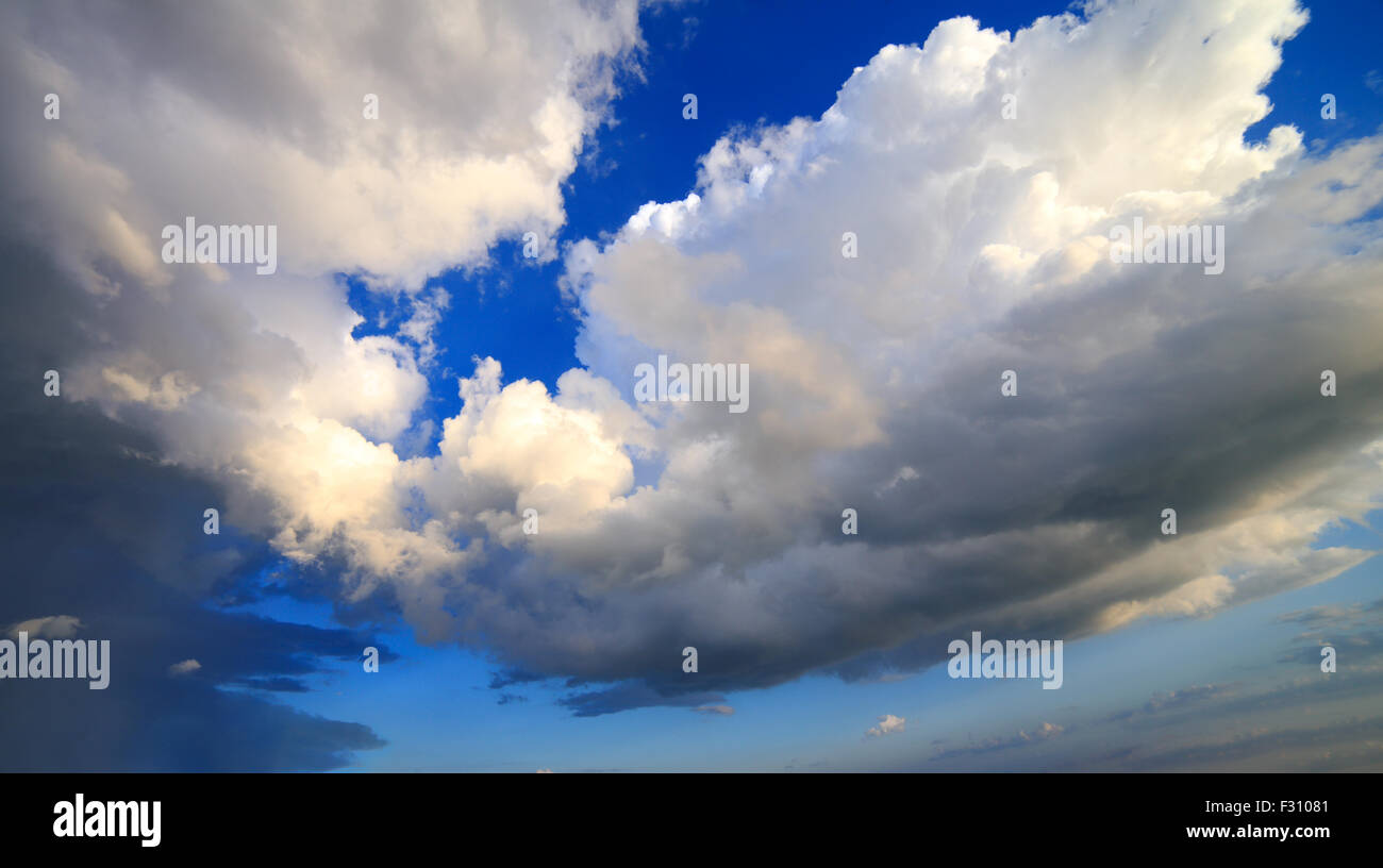 Clouds over the sea dramatic blue sky Stock Photo - Alamy
