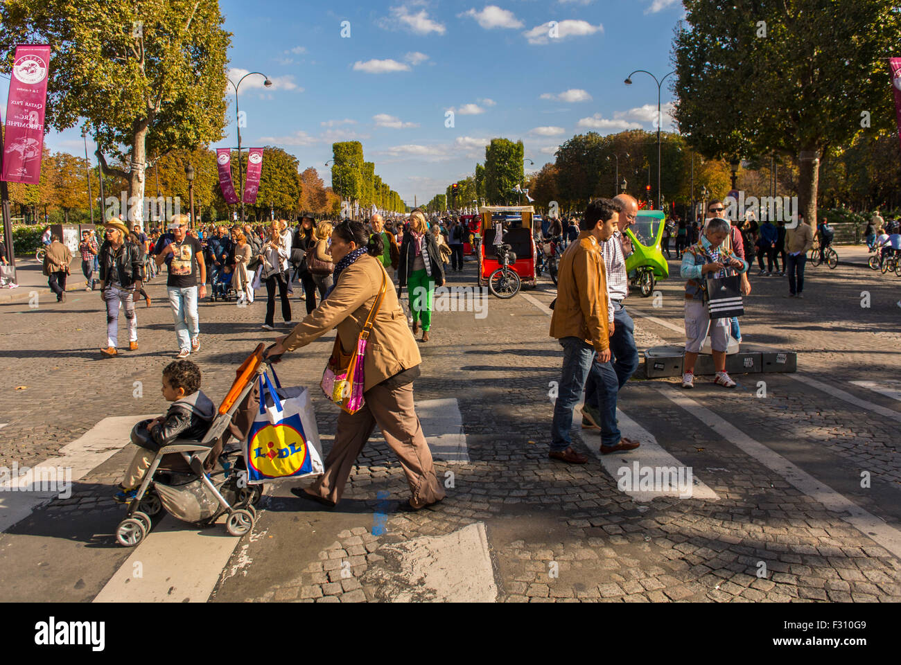 Paris, France. People Crossing Street, Participating at Environmental Street Event, 'Journée Sans Voiture', (Day Without C-ars) , Avenue des Champs-Elyees, Stock Photo