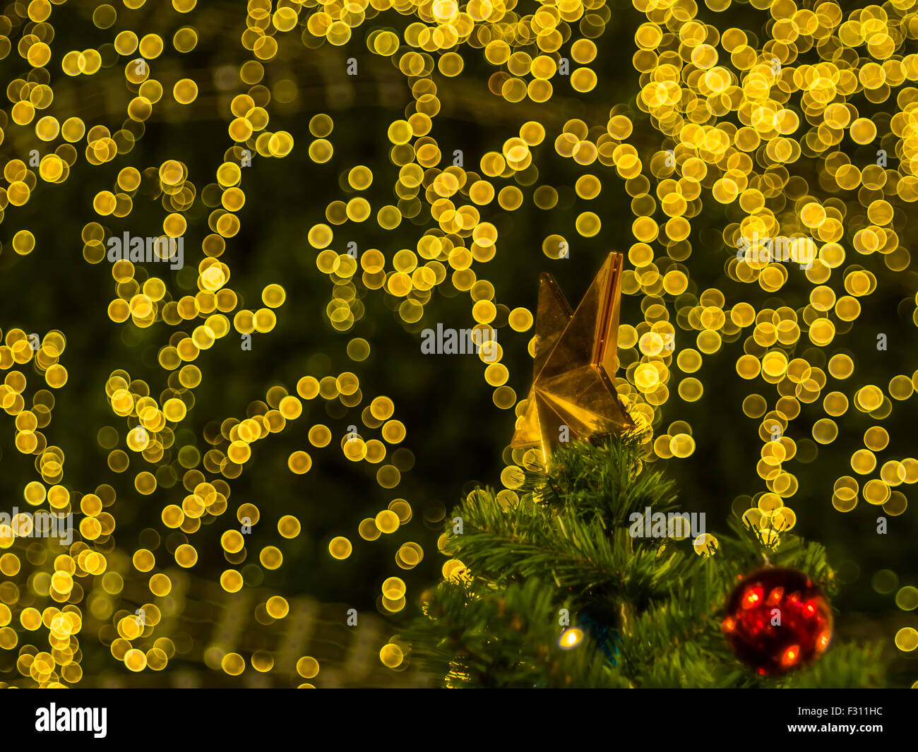 Star on the top of christmas tree on bokeh light background Stock Photo ...