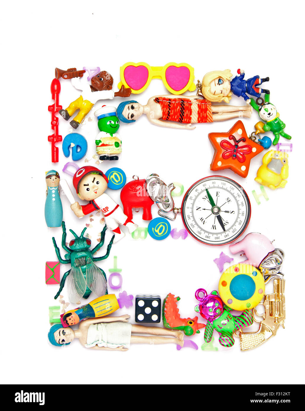 the letter B made from lots of old small toys Stock Photo Alamy