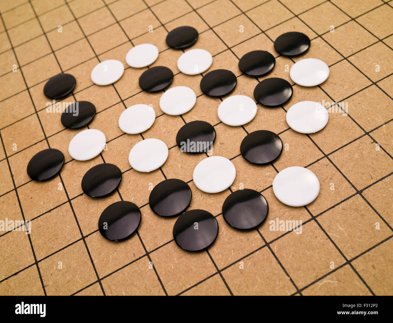 closeup view of stones on a Go board Stock Photo