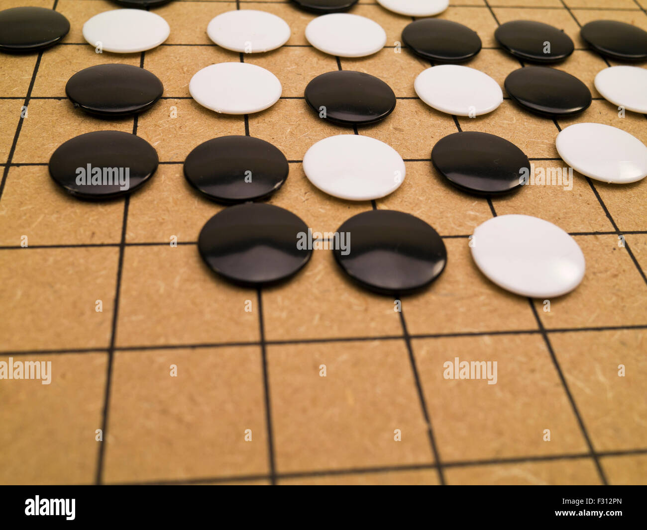 closeup view of stones on a Go board Stock Photo Alamy