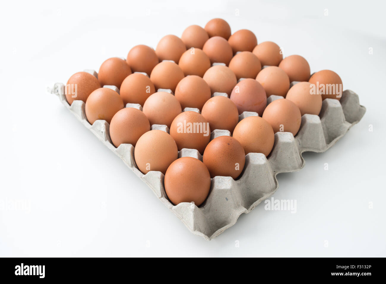 eggs in carton package isolated on white Stock Photo