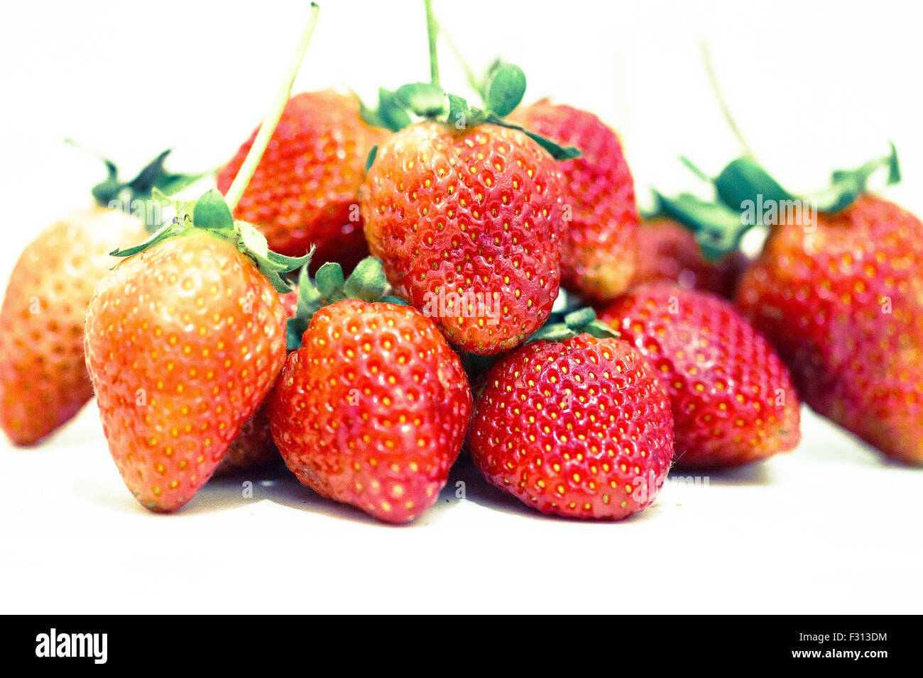 Strawberry berries on a white background Stock Photo - Alamy