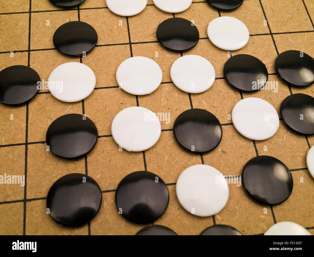 closeup view of stones on a Go board Stock Photo
