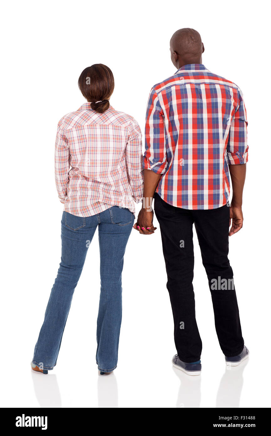 rear view of young afro American couple holding hands isolated on white ...