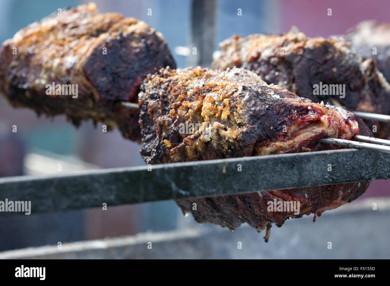 Lamb cooking over an open fire Stock Photo Alamy