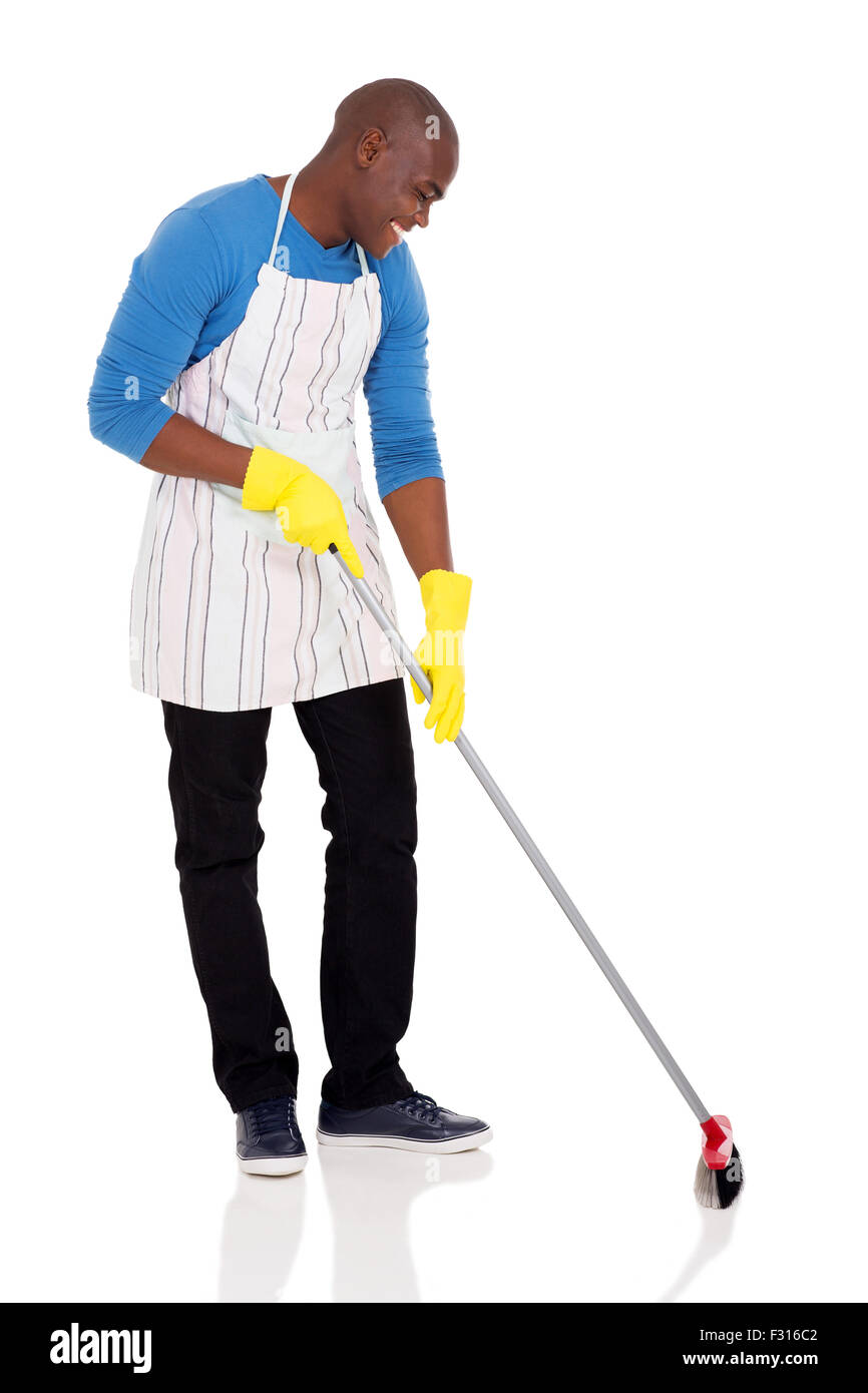handsome African American man sweeping on white background Stock Photo