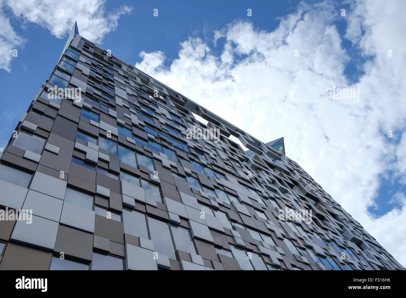 The Cube, a shot of the iconic modern building in Birmingham, England, showing reflections of a glorious blue summer sky. Stock Photo
