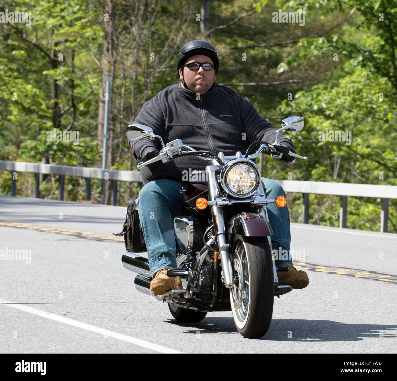 Fat Man Riding Motorcycle High 