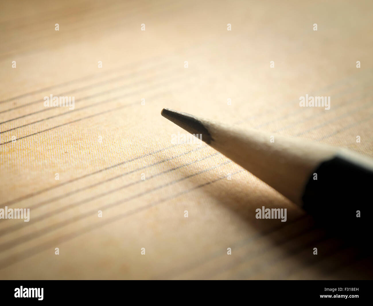 Pencil and old blank sheet music notation, selective focus Stock Photo