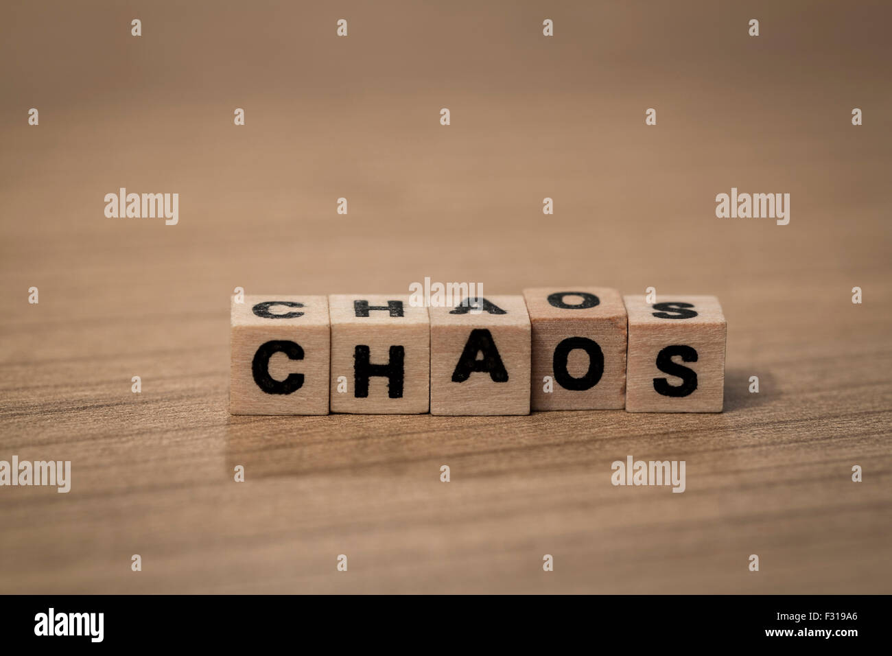 Chaos written in wooden cubes on a desk Stock Photo