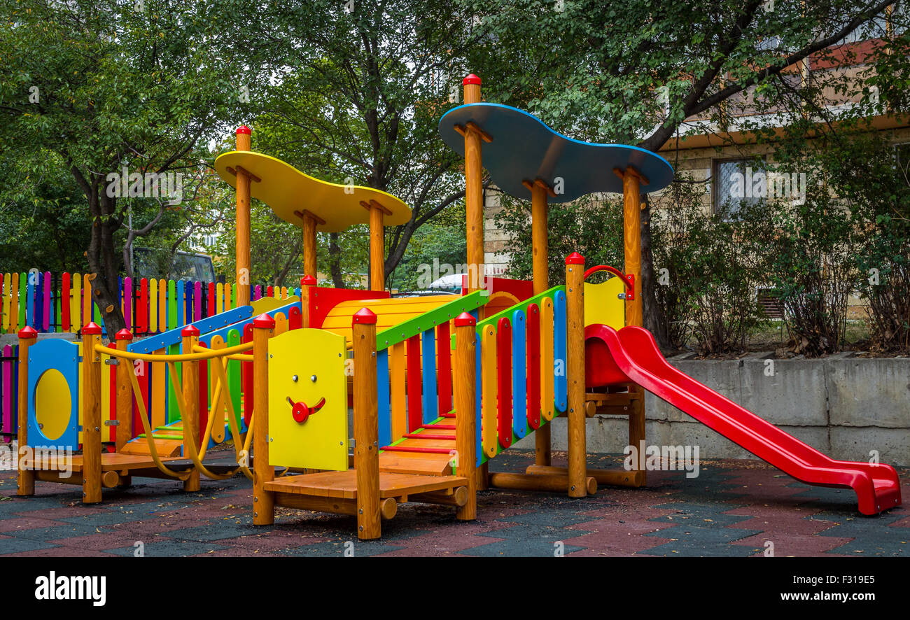 School playground swing slide hi-res stock photography and images - Alamy