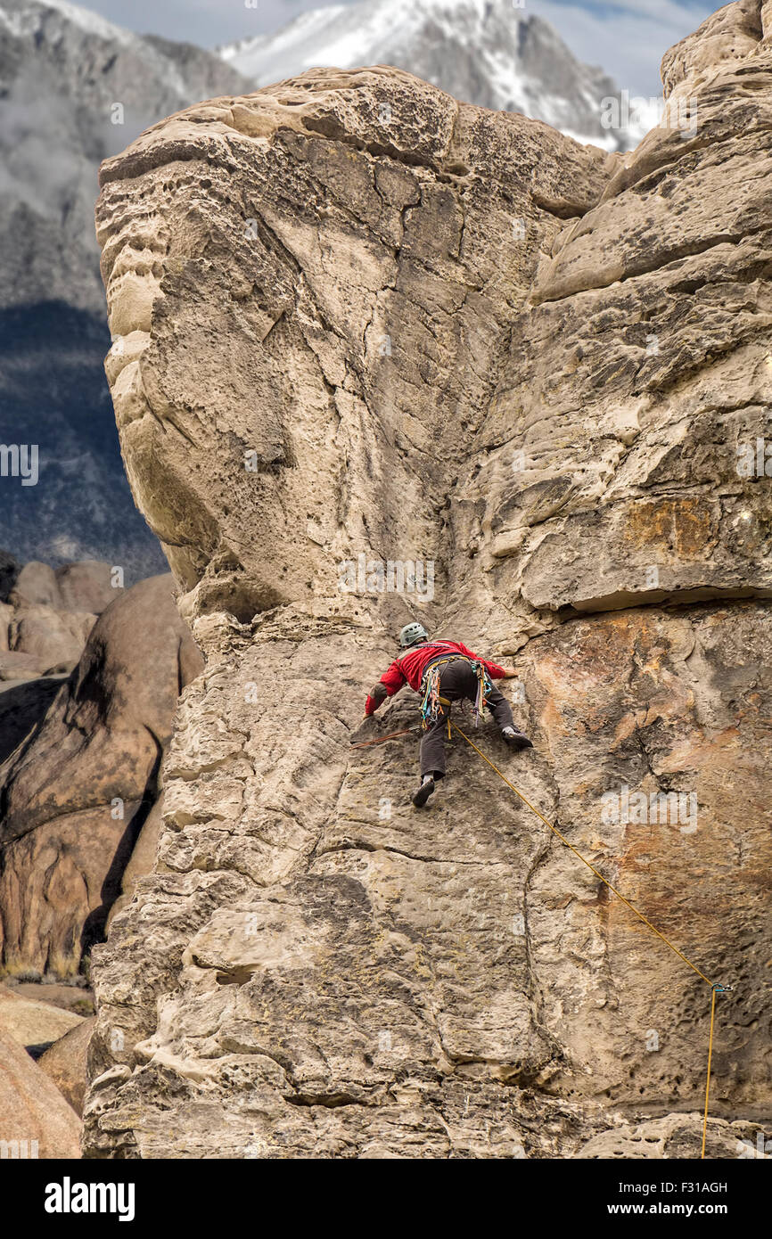 Mountain climber in Alps climbing a rock. Stock Photo