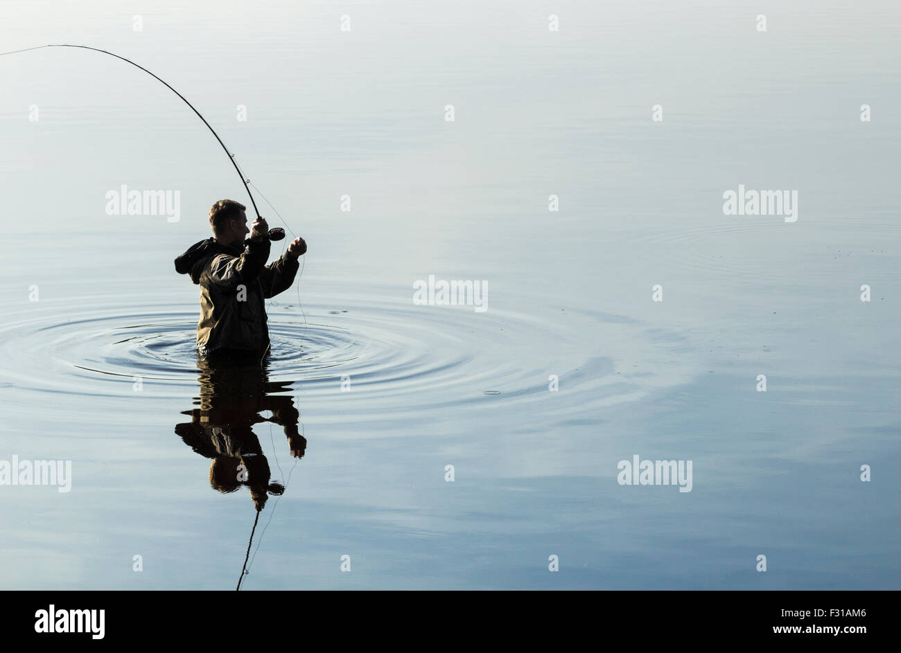 Man fly fishing at Lockwood Beck, North Yorkshire, UK. Stock Photo