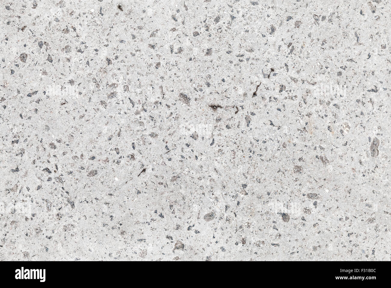 Seamless background texture of gray concrete wall with gravel Stock Photo