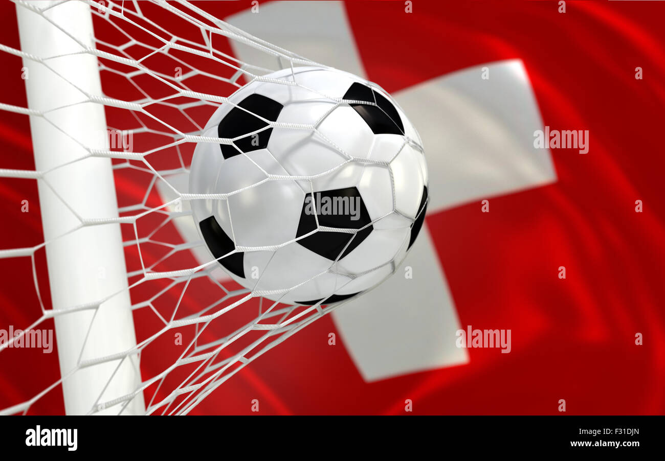 Switzerland flag and soccer ball, football in goal net Stock Photo - Alamy