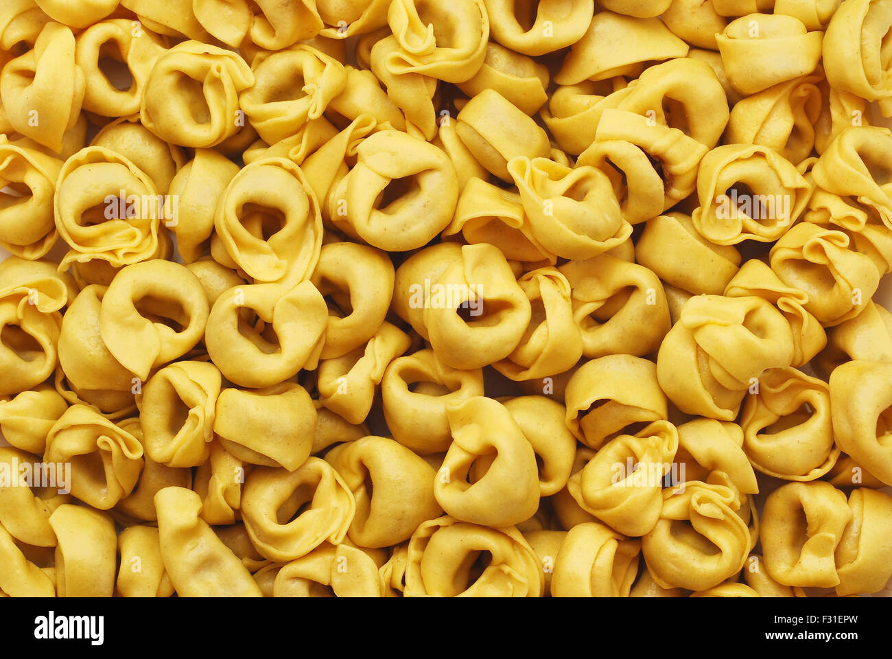 tortellini pasta background closeup texture Stock Photo - Alamy