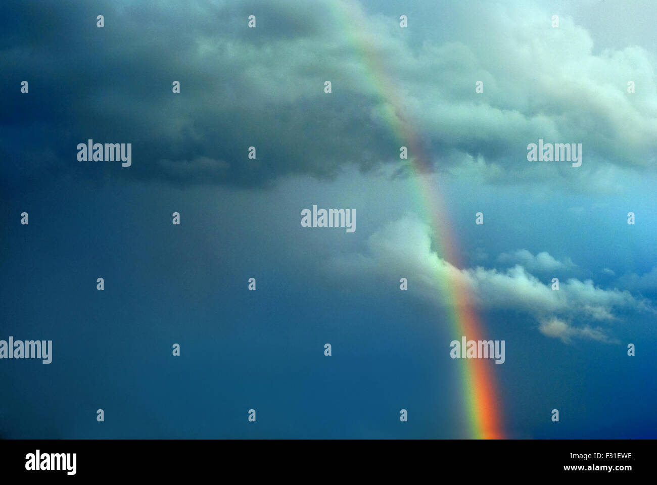 rainbow on stormy sky Stock Photo - Alamy