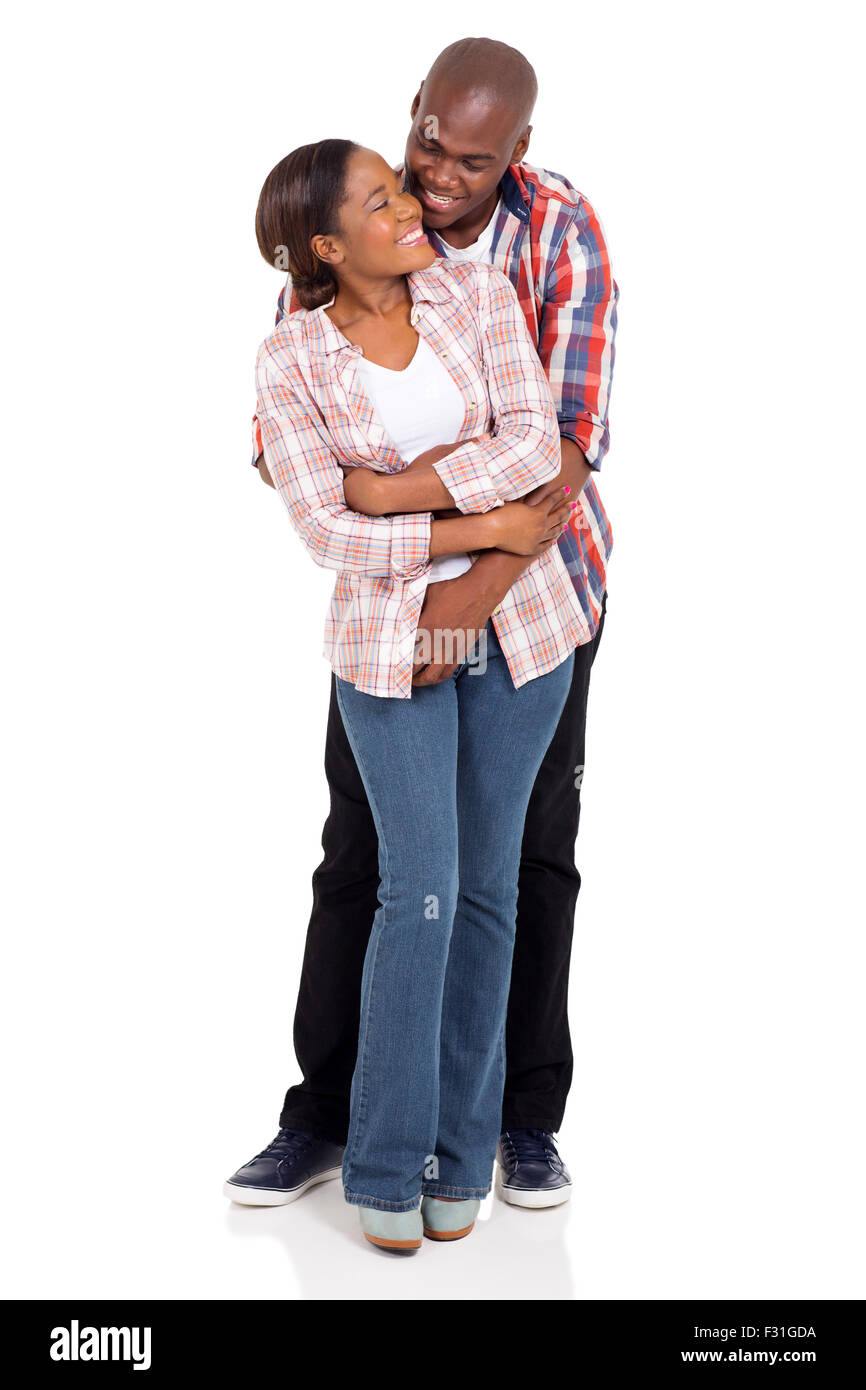 portrait of lovely African couple embracing over white background Stock ...