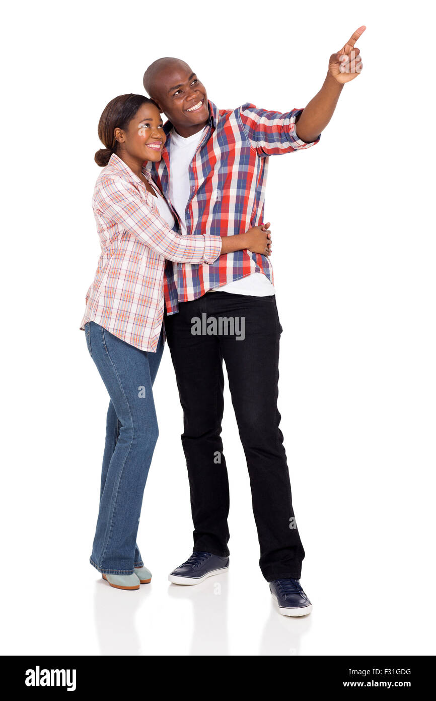lovely African American couple pointing on white background Stock Photo ...