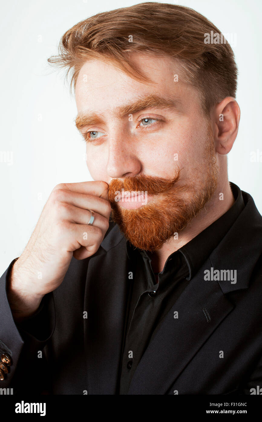 young red hair man with beard and mustache in black suit on white background Stock Photo - Alamy young red hair man with beard and mustache in black suit on white background Stock Photo - Alamy