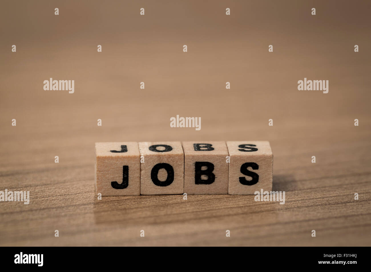 Jobs written in wooden cubes on a desk Stock Photo