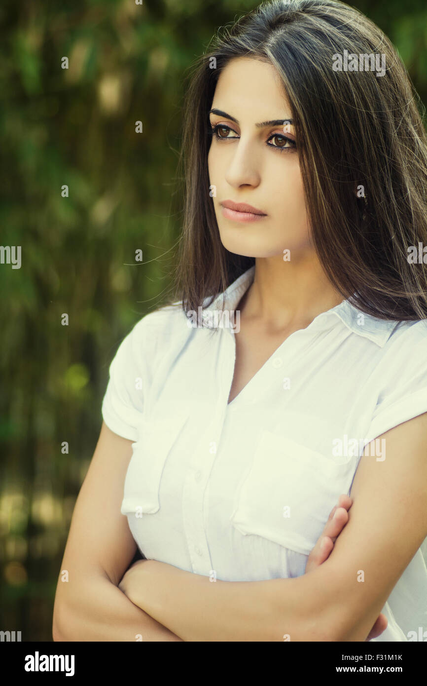 Woman standing with arms folded hi-res stock photography and images - Alamy