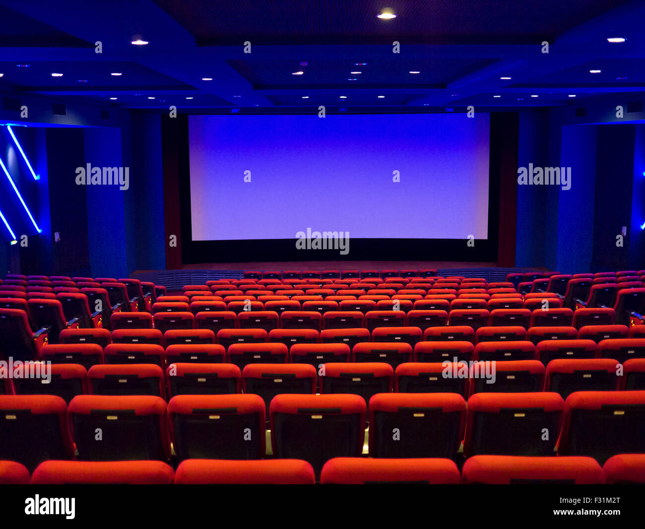 Empty cinema auditorium. Projection screen is ready for adding a picture Stock Photo