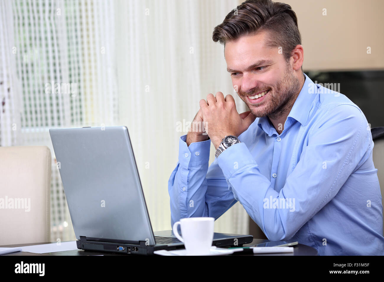 Young handsome man checks hi-res stock photography and images - Alamy